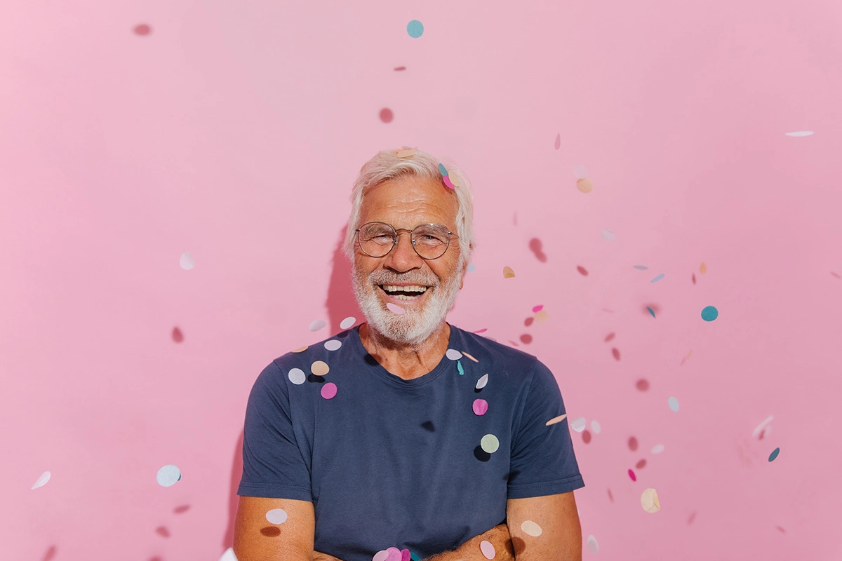 Medicare and Still Working Past 65-Man-65th-birthday-confetti