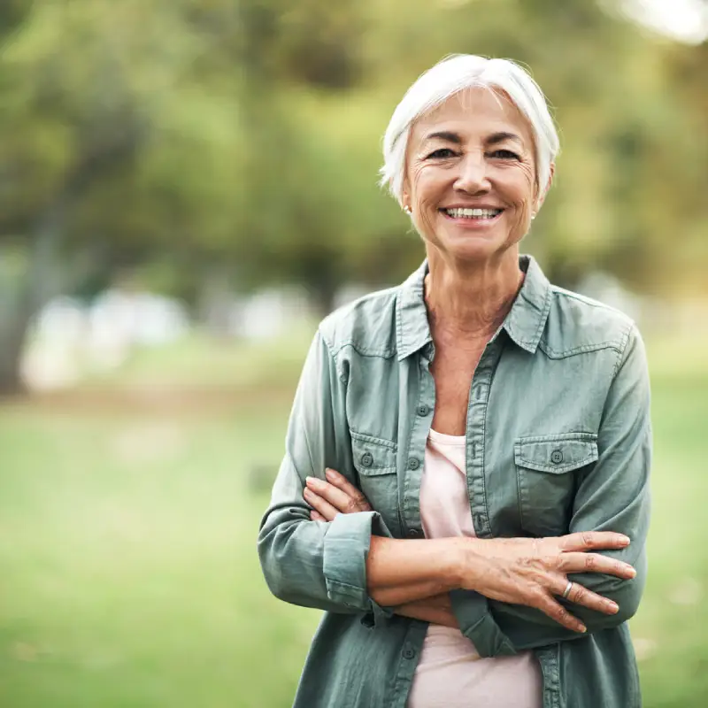 happy-woman-green-shirt-outdoor