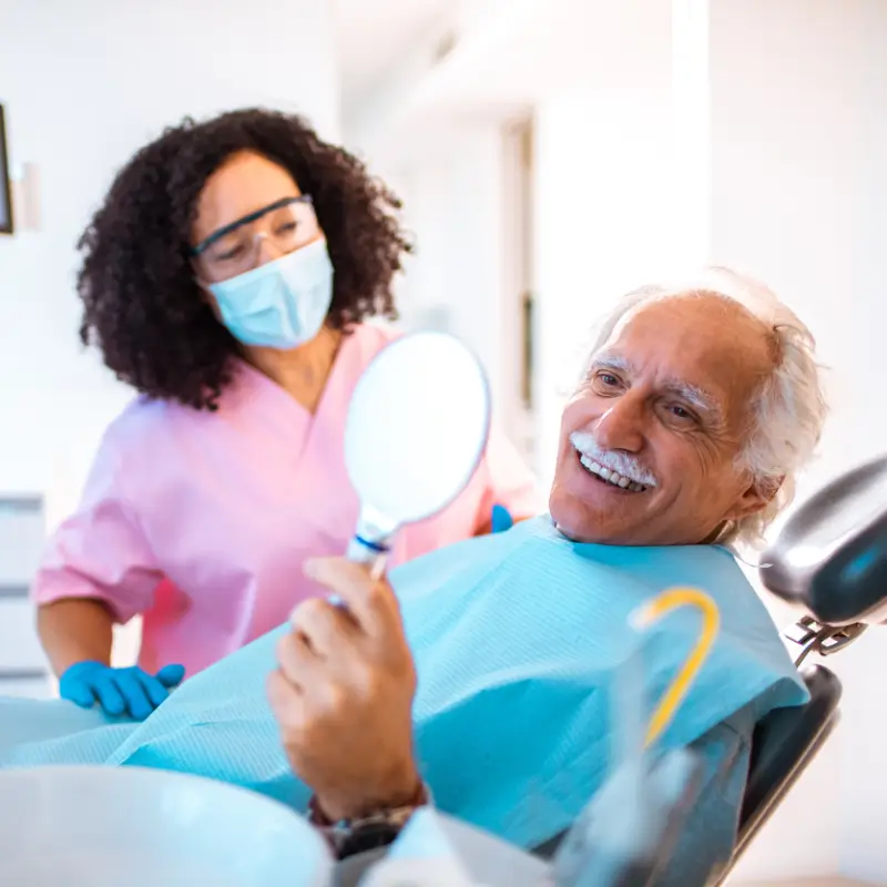 senior-happy-with-dental-implants