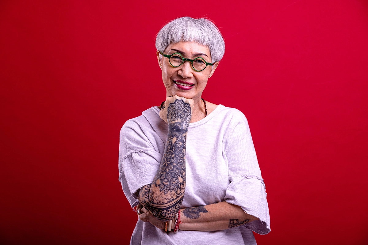 Medicare Enrollment FAQs - tattooed-senior-woman