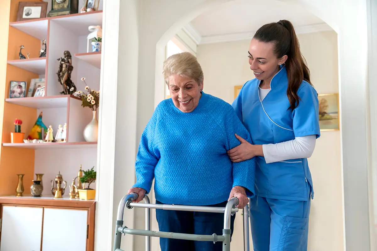 caregiver-helping-elderly-woman