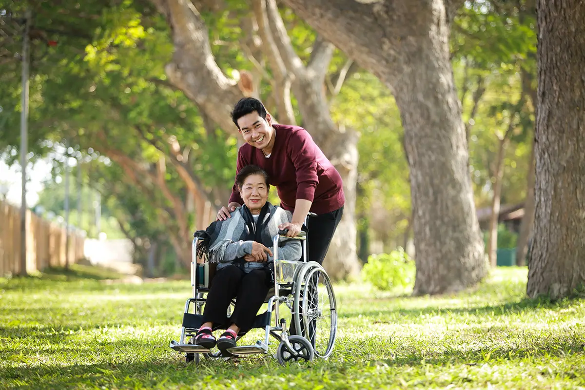 elderly-woman-wheelchair-caregiver-outside