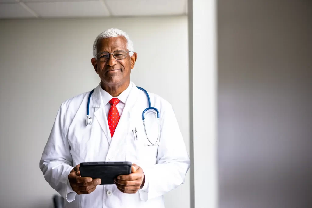 male-senior-doctor-holding-clipboard