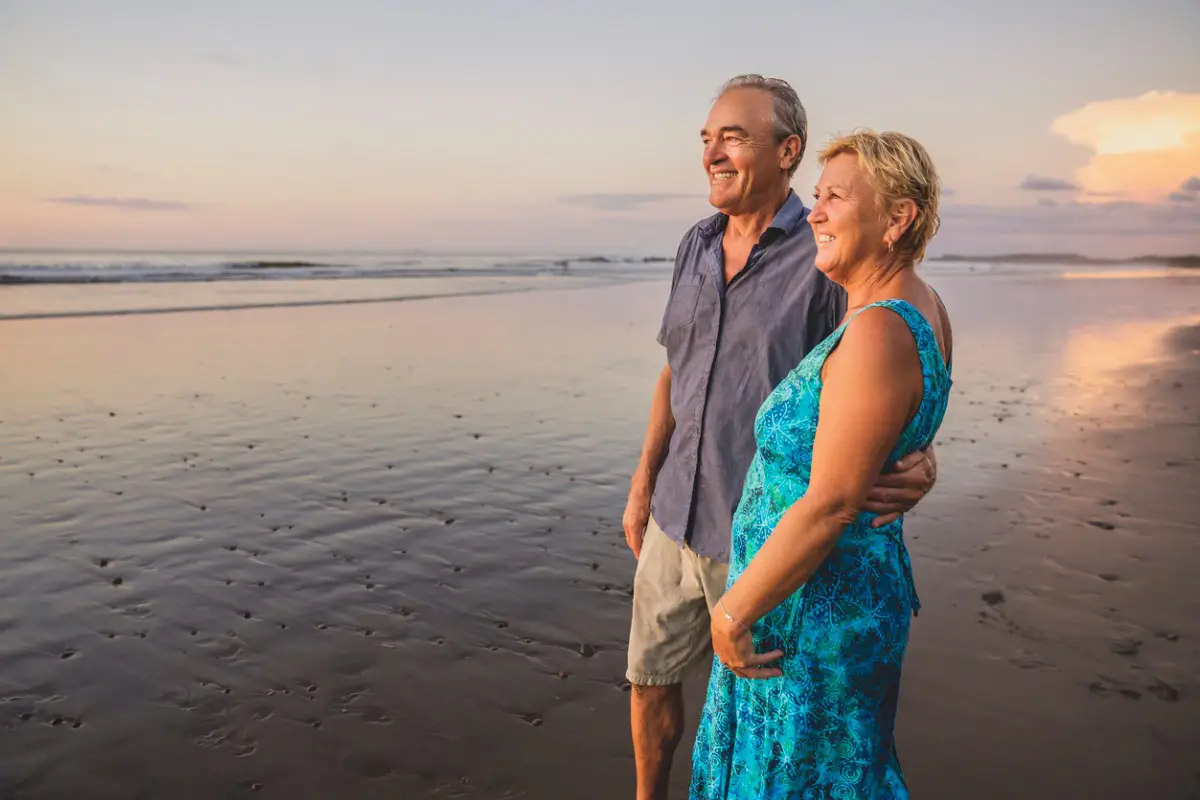 senior-couple-sunset-beach