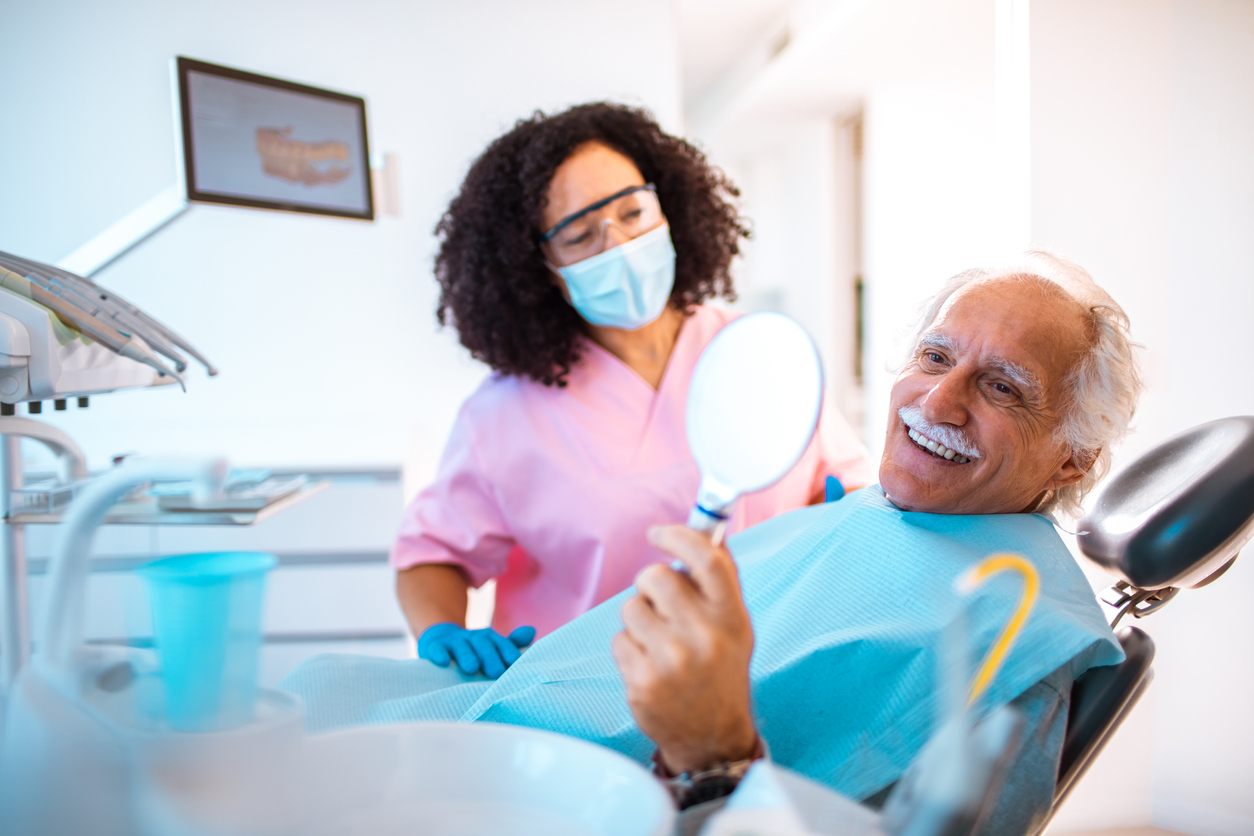 senior-happy-with-dental-implants