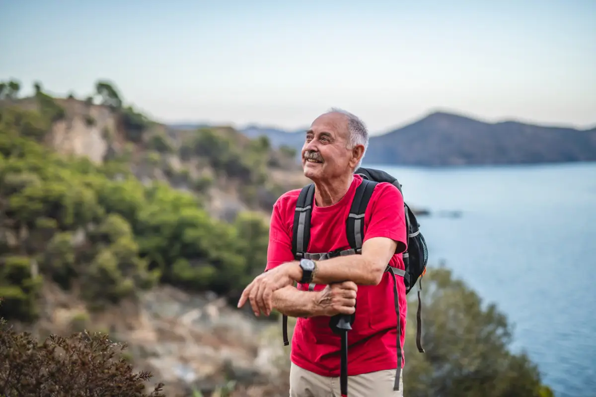 senior-man-backpacking-red-shirt