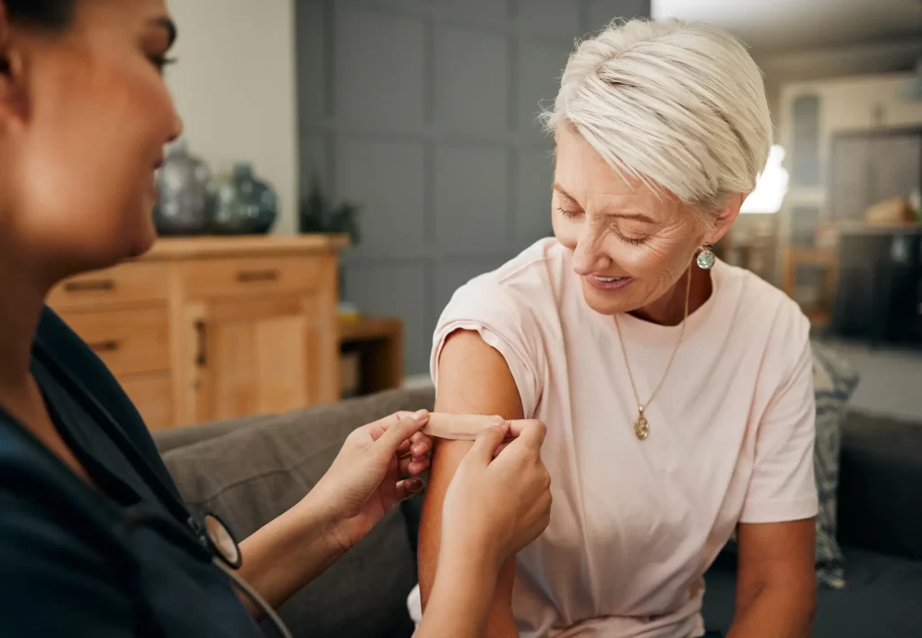 senior-woman-bandage-vaccine