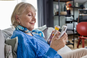 Senior woman using mobile health app