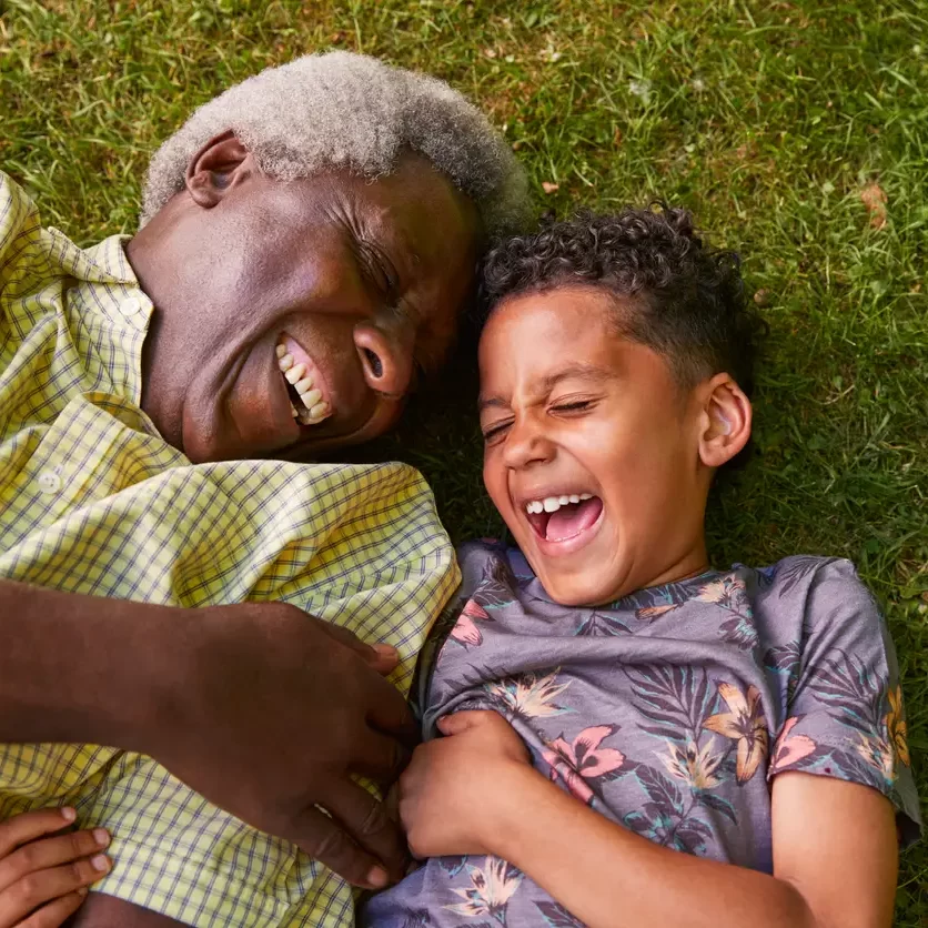 grandfather-on-grass-with-grandson