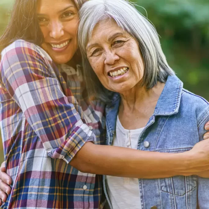 mother-daughter-embrace-outdoors