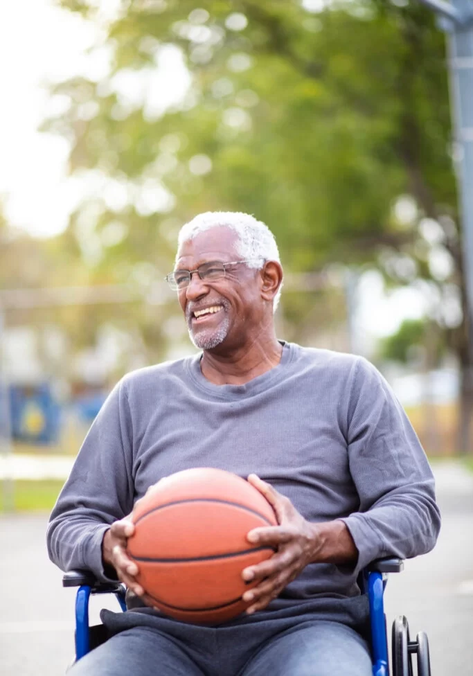 older-man-playing-basketball-in-wheelchair-683x1024