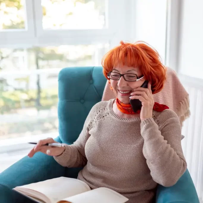 red-hair-woman-in-blue-chair