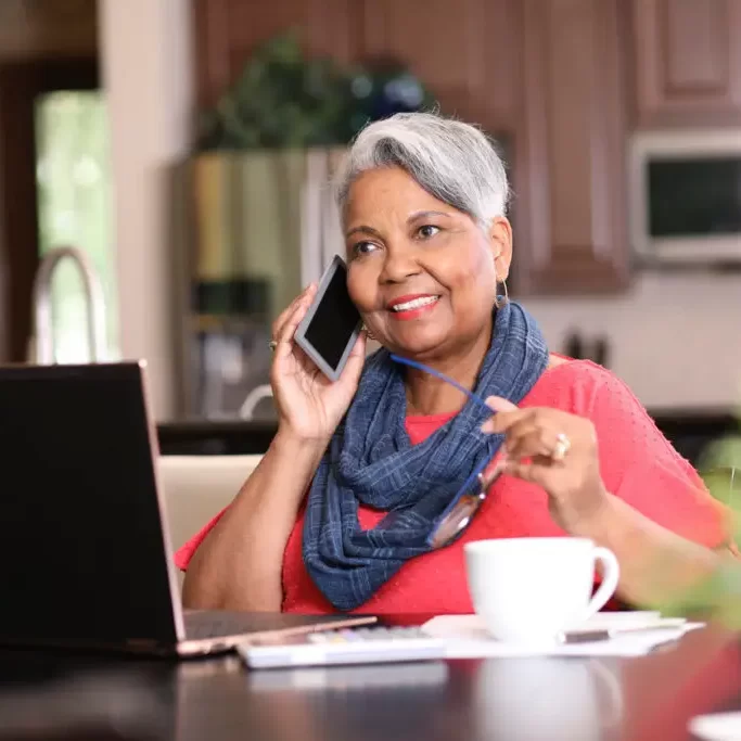 senior-woman-wearing-scarf-laptop