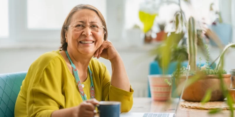 smiling-senior-woman-in-green-1024x683