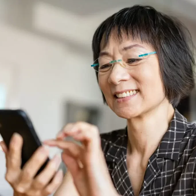 woman-sleeveless-plaid-phone